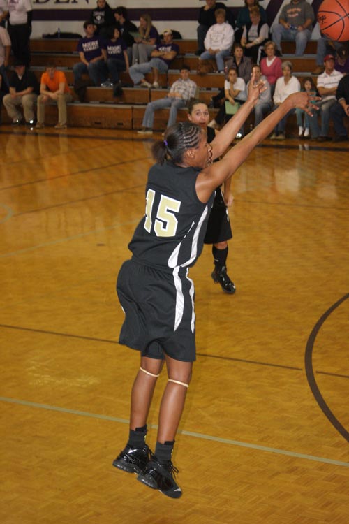 Tenna Carter, a freshman from Milan, Tenn., launches a long three-pointer in the TranSouth Quarterfinal game against TNU.
